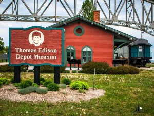 The Thomas Edison Depot Museum sits under the Blue Water Bridges on the Thomas Edison Parkway in Port Huron.  Photo by Grace Grogan