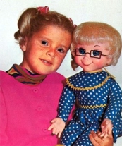 Buffy from the TV show Family Affair and her doll Mrs. Beasley.  Photo located online.