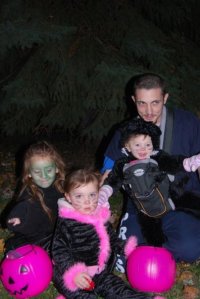 Patrick and his girls out trick-or-treating.  Photo by Grace Grogan 2009.