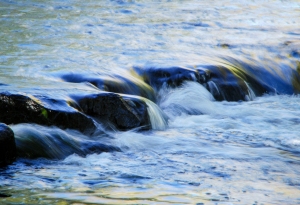 Water flow over rocks, Paint Creek, Rochester, Michigan.  Photo by Grace Grogan, copyright 2014