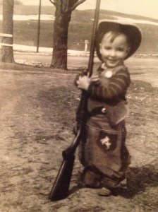 My Dad and a gun.  he was about 3 years old at the time.