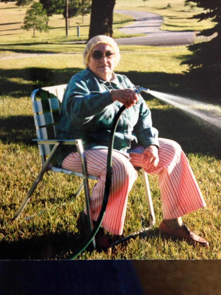 Grandma watering her garden